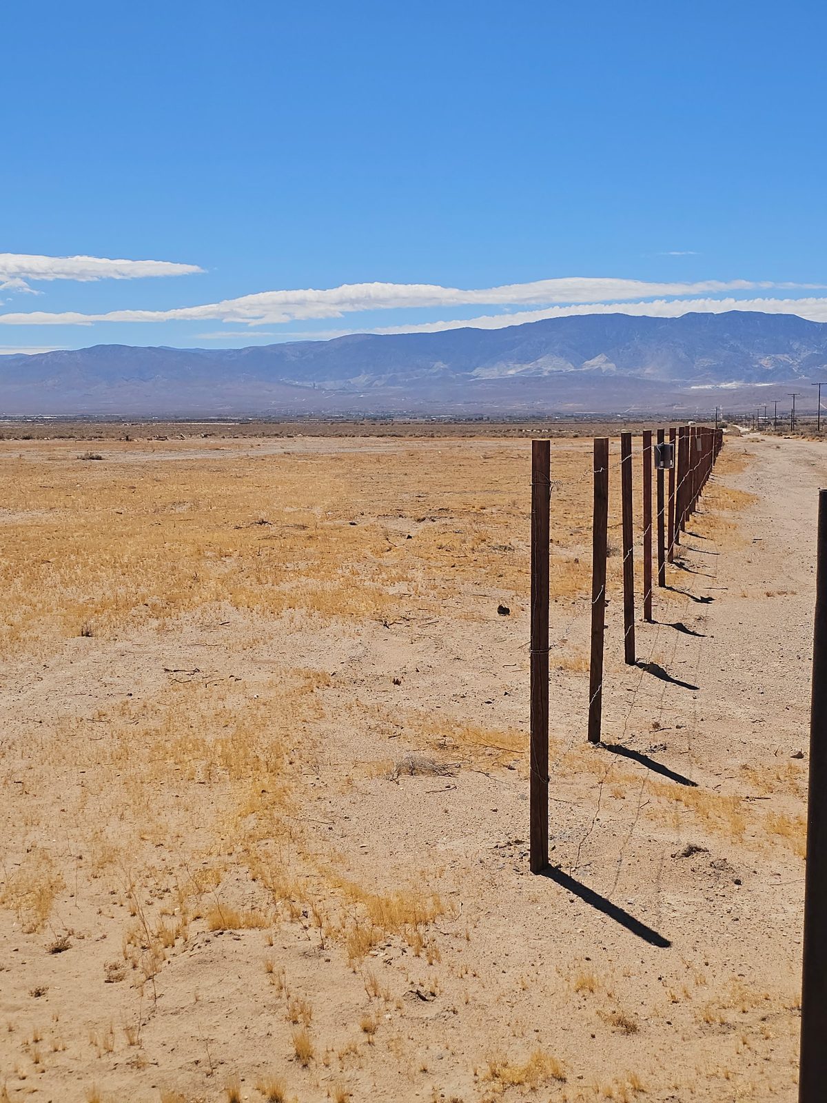 Level desert acreage at 34525 Northside Rd with the San Bernardino Mountains on the horizon